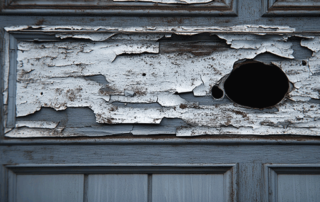Garage door panel showing common types of damage and repair solutions