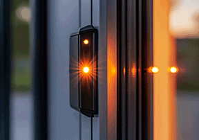 Garage door safety sensor system showing alignment and obstruction detection