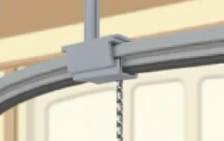 Garage door track showing subtle misalignment in the curved section with roller positioning slightly off center
