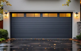 Modern three-car garage with weatherstripping on European-style home in Villebois during spring morning